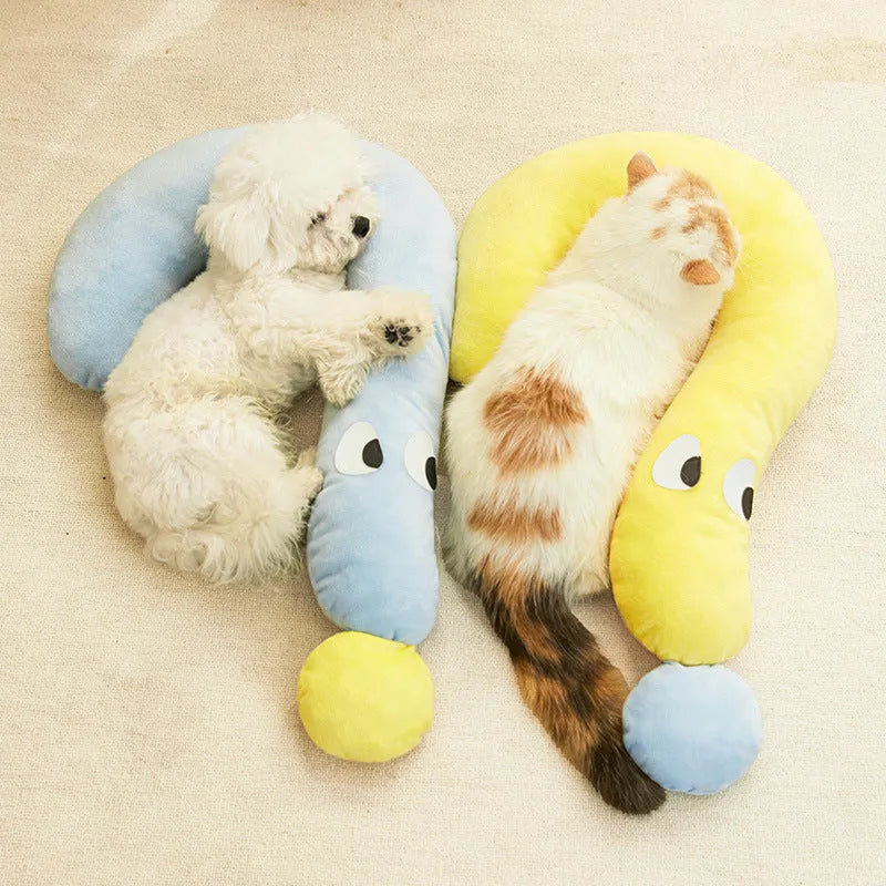 Blue pet sleeping pillow measuring 62cm by 39cm on a dog bed