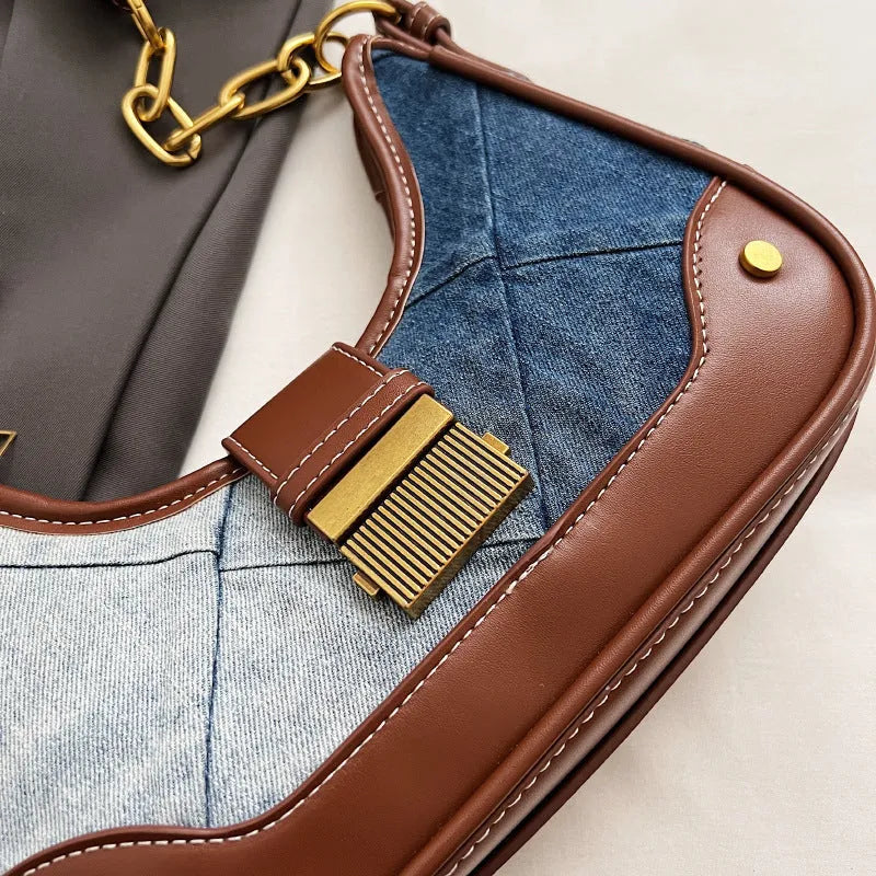 Brown denim bucket shoulder bag with diamond mesh panels and metallic chain strap