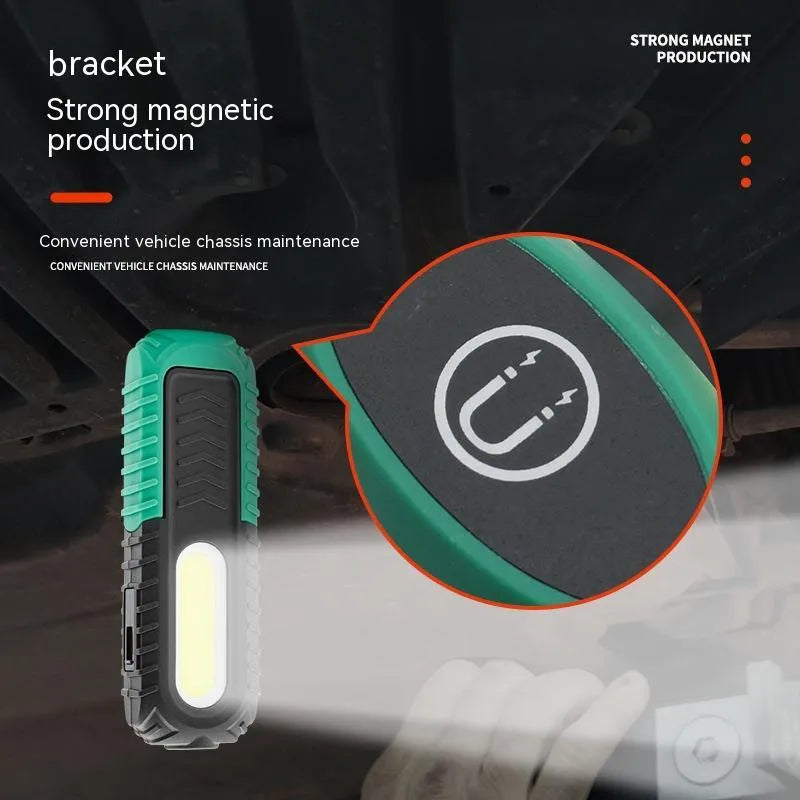 Black and green auto repair work light with USB charging cable for vehicle inspections