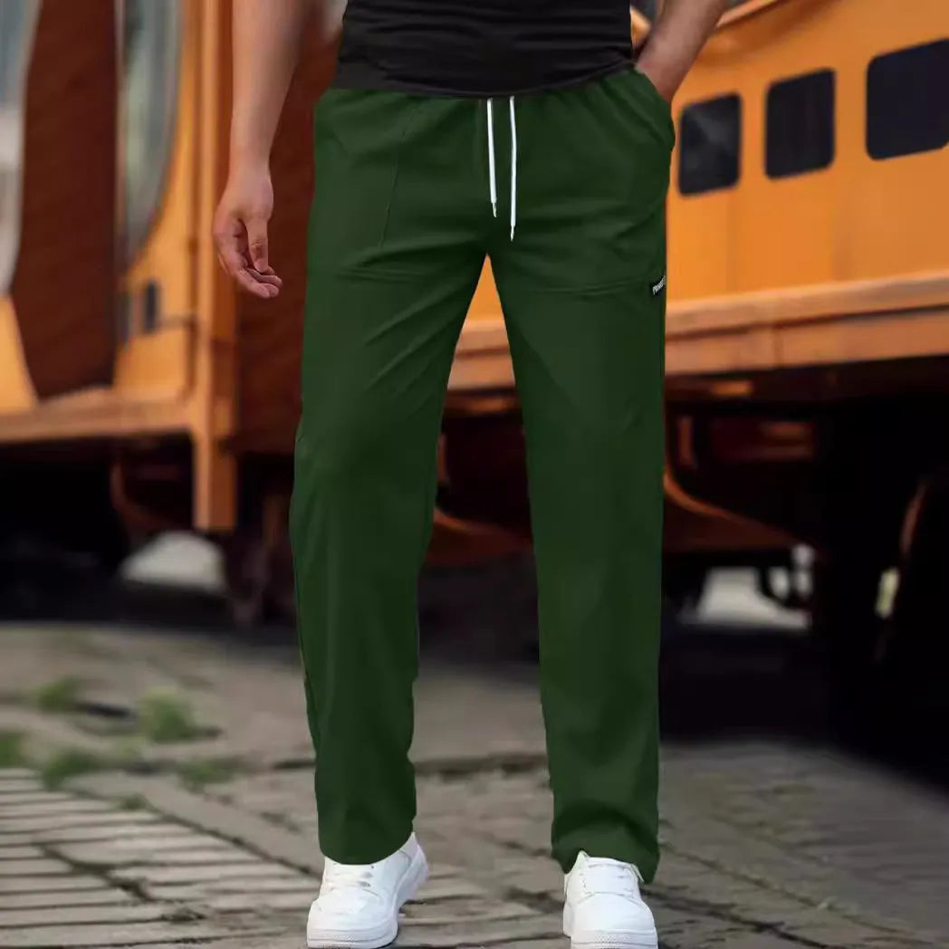 Men's light grey polyester casual trousers laid flat showing front design.