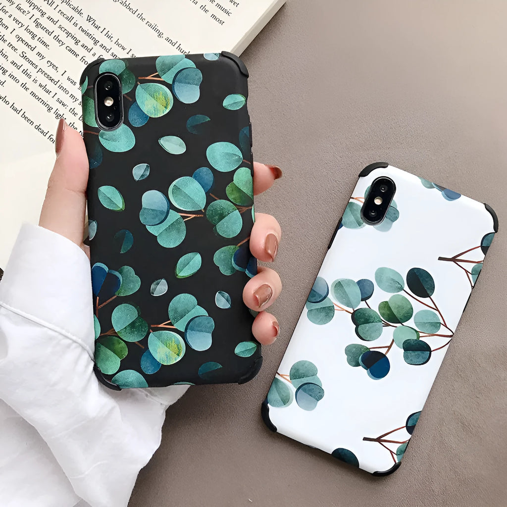 Black silicone iPhone case featuring a detailed leaf print design on the back.