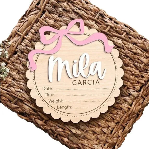 Square wooden baby room ornament personalised with a name, shown in 13cm and 15cm sizes.