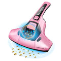 Pink handheld vacuum mite cleaner with motor unit and long cord on a grey sofa