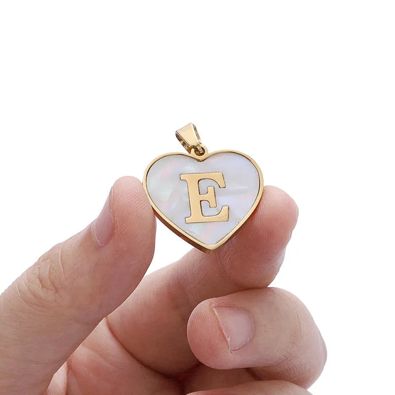 Personalised white shell heart necklace with gold chain and initial letter engraving