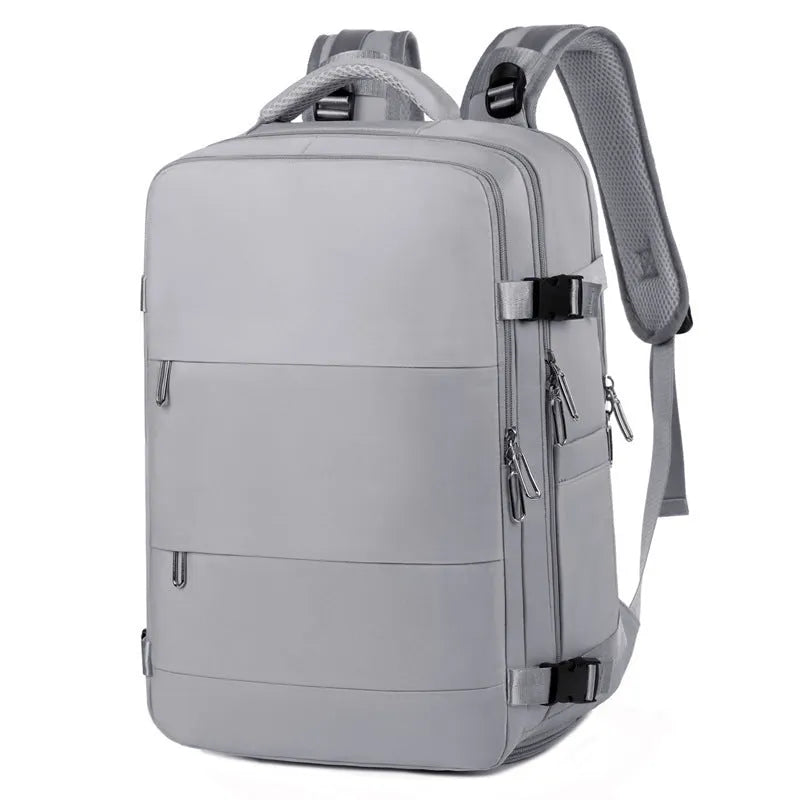 Large grey travel backpack with multiple pockets and an air pillow belt, shown open to reveal internal organisation.