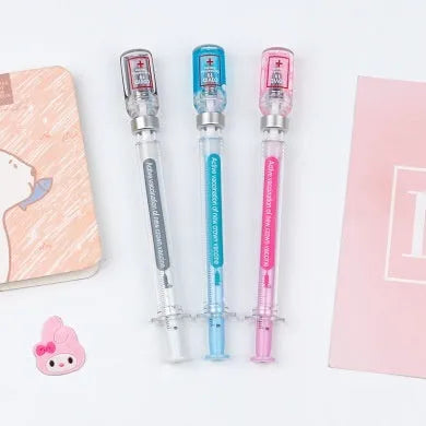 Black and clear plastic vaccine syringe design gel pen with 0.5mm tip on white background.