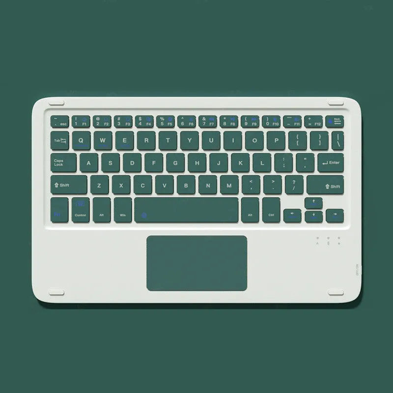 Pink mute wireless Bluetooth mouse and matching touch keyboard on a desk
