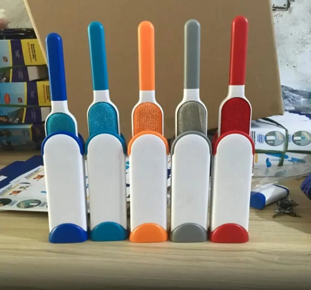 Reusable pet hair removal comb with a self-cleaning base, shown in blue, for cleaning cat and dog fur from sofas.