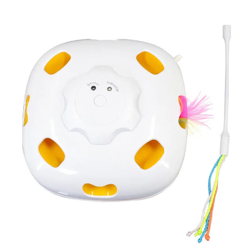 Plastic self-hi relief cat toy with teaser attachment measuring 19.8 by 11.5 by 19.5 centimetres