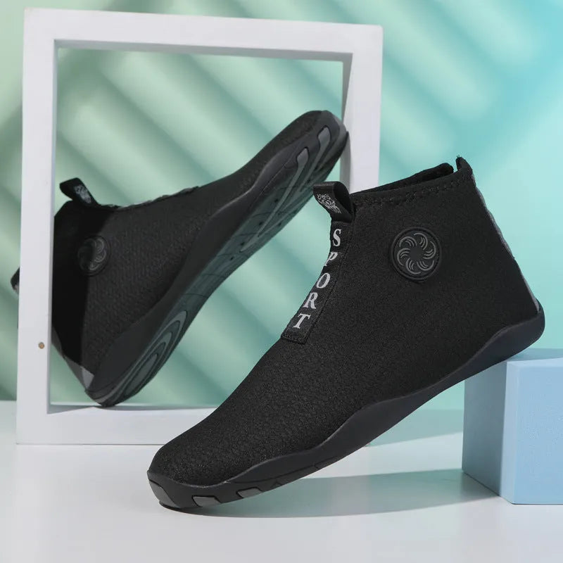 Black and fluorescent green mid-top beach shoes with mesh upper and rubber sole