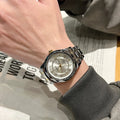 Women's dual calendar business watch with 7mm slim gold case, steel strip strap and white dial surface