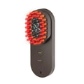 Smart massage comb with red light therapy in pink colour, measuring less than 10cm
