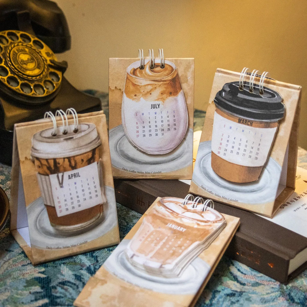 Mini 2025 desk calendar set showing four different themed designs including coffee and motivational messages.