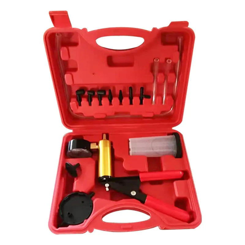 Manual aluminium vacuum air blow gun car dent repair tool on a workshop bench.
