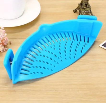 Silicone clip-on kitchen strainer with stainless steel mesh attached to cooking pot