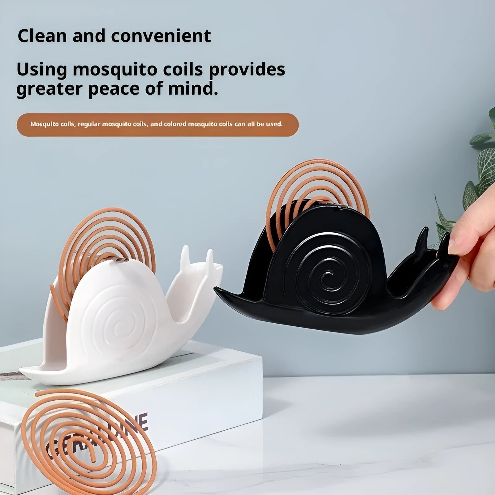 Black plastic mosquito incense holder with creative animal style on a flat surface