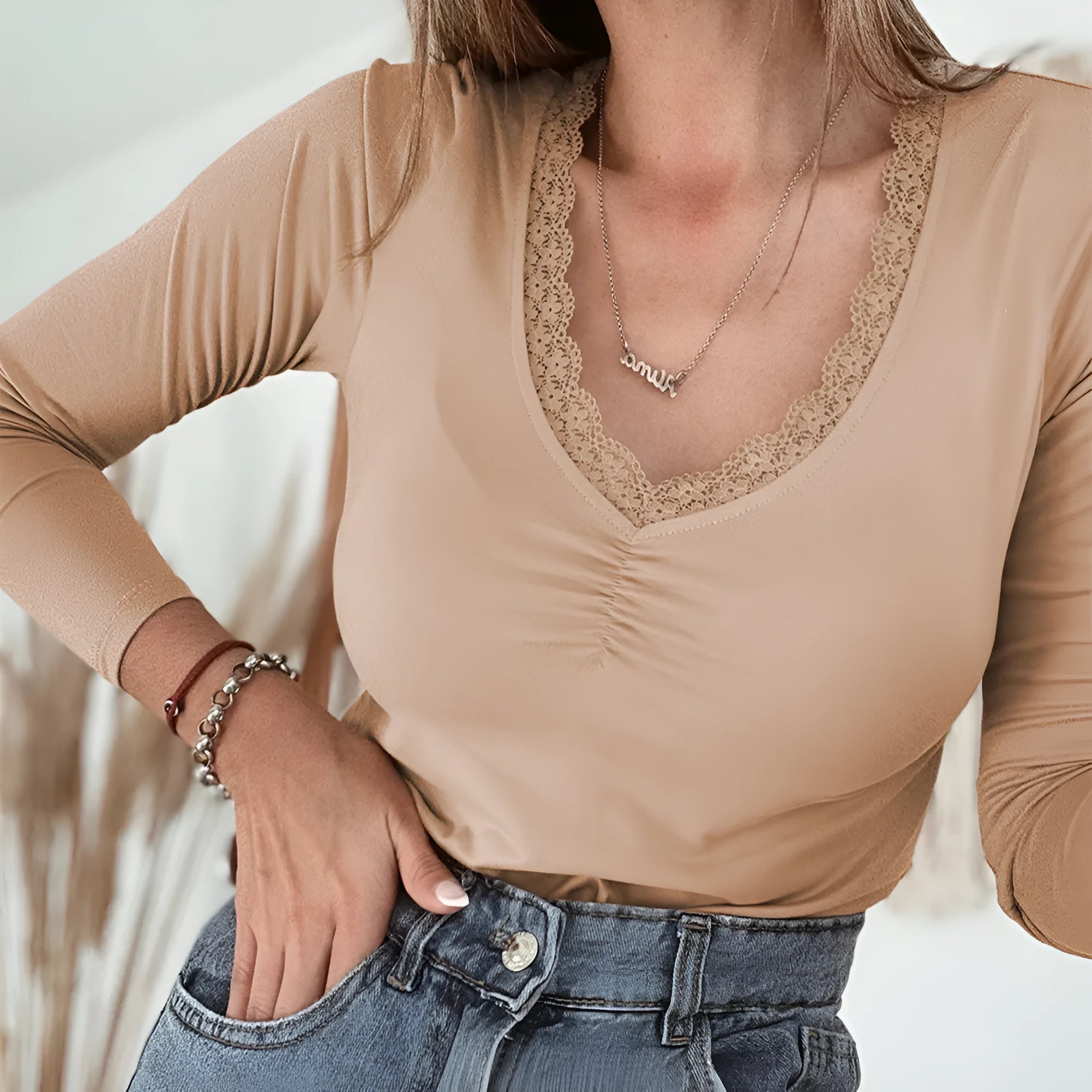 Long sleeve casual top with lace trim detail in solid colour option showing slim fit styling