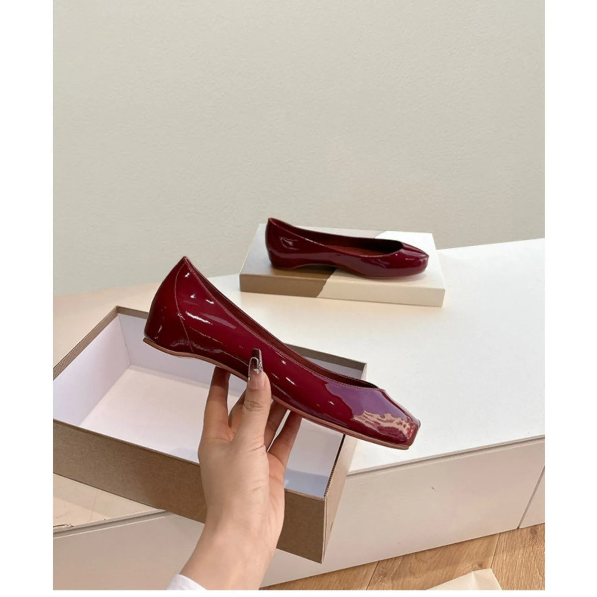 Women's slip-on flat bottom split toe pumps in red with low heel and rubber sole