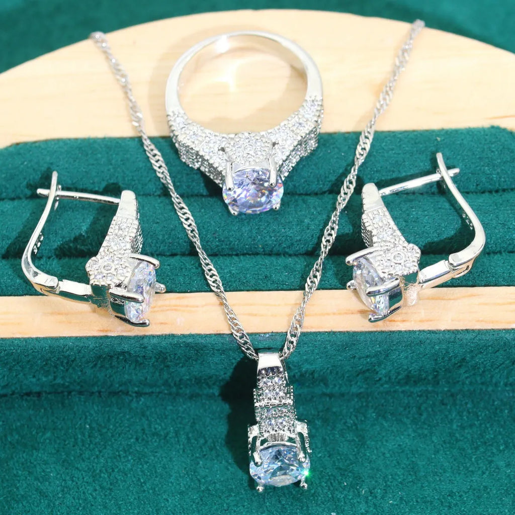 Bridal zircon necklace, bracelet, earrings, and ring four-piece jewellery set in alloy with water wave chain design.