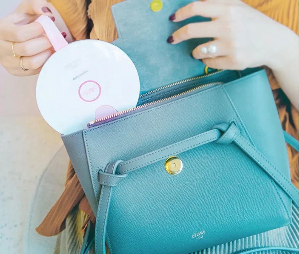 A slim, portable UV-C baby bottle steriliser in blue, showing its compact size and USB port.