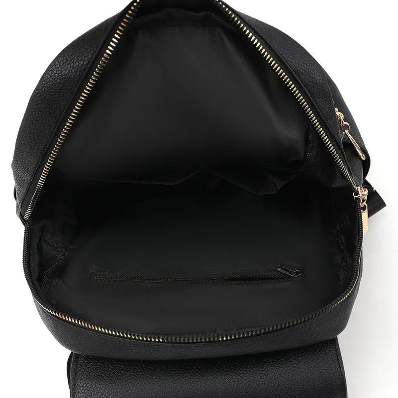 Casual women's leather backpack in black with textured pu finish and three-dimensional pocket design