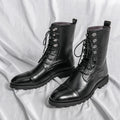 Black denim lace-up booties with lace closure and low heel on a white background