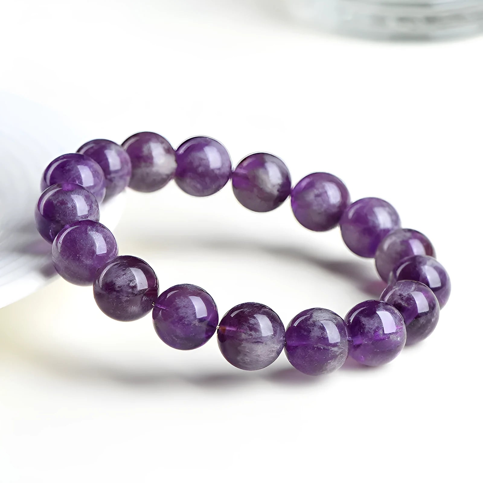 Natural Snow Mountain Purple feather amethyst crystal bracelet with geometric Ruyi pattern.