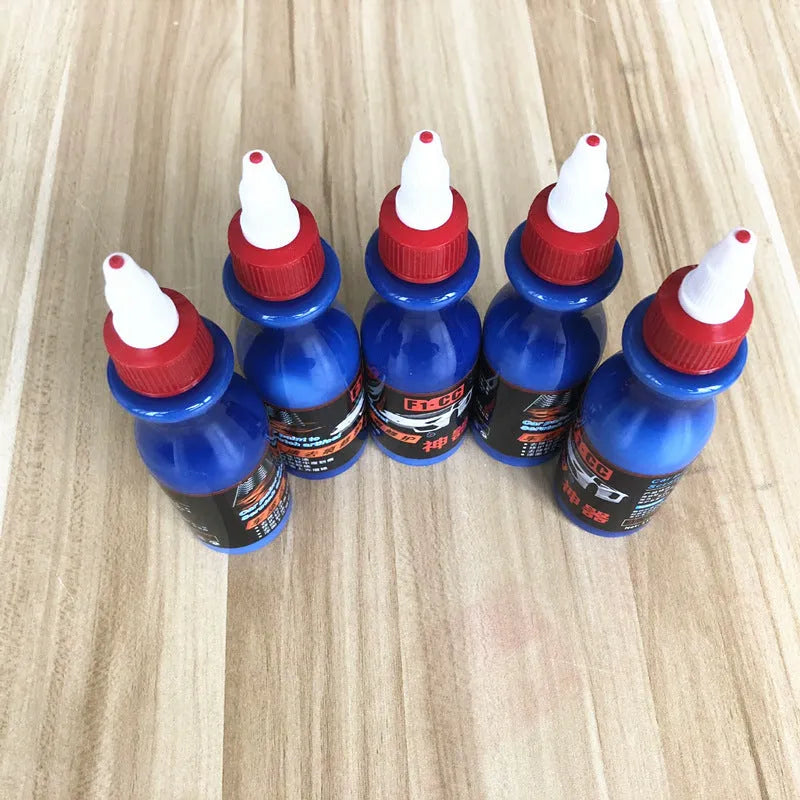 Small blue car scratch repair tool with applicator for automobile surface treatment