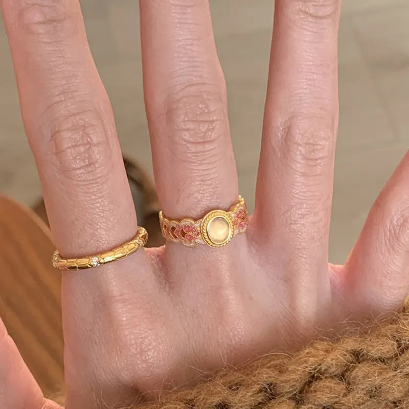 Pink crystal enamel geometric open mouth ring for women on gold-plated copper band.