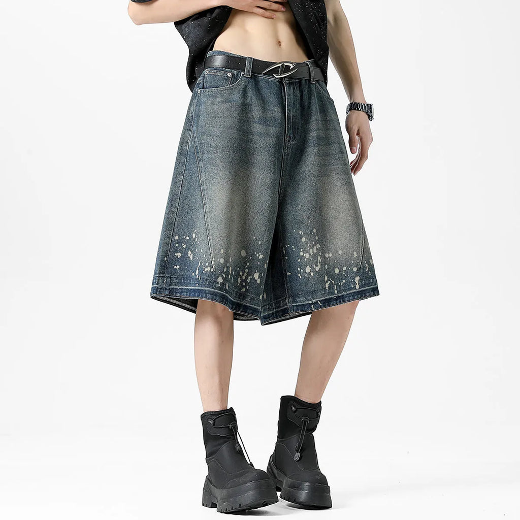 Men's retro blue washed denim shorts with ripped splash ink detailing, straight cut design