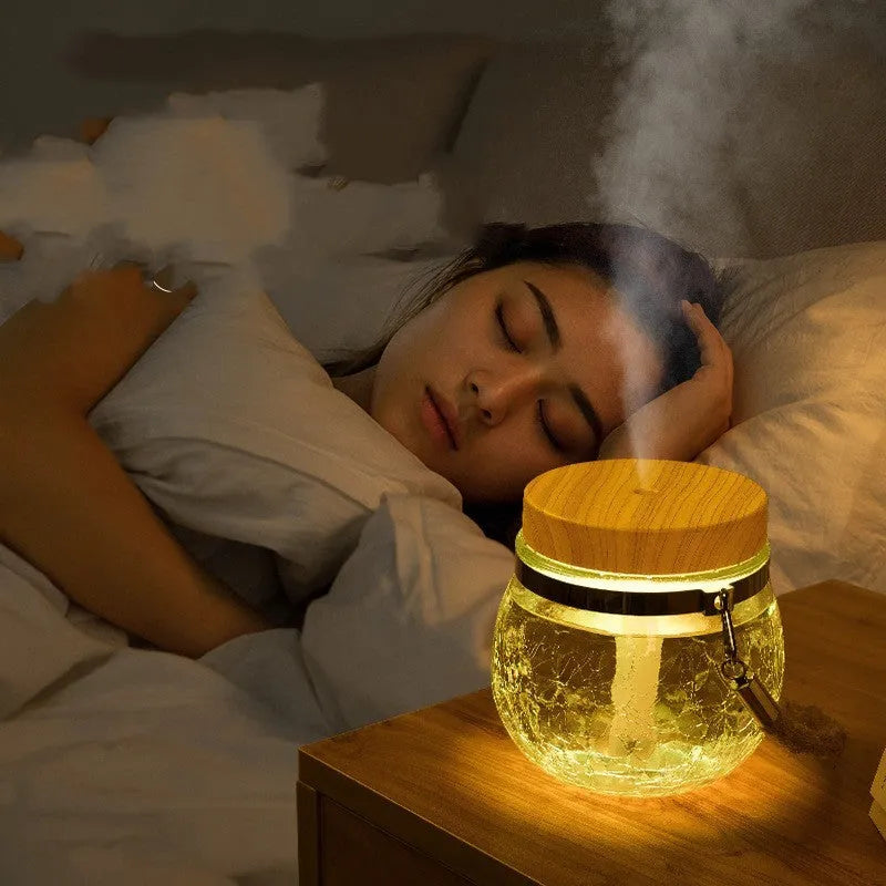 Round desktop USB humidifier in white plastic and glass with heavy fog output