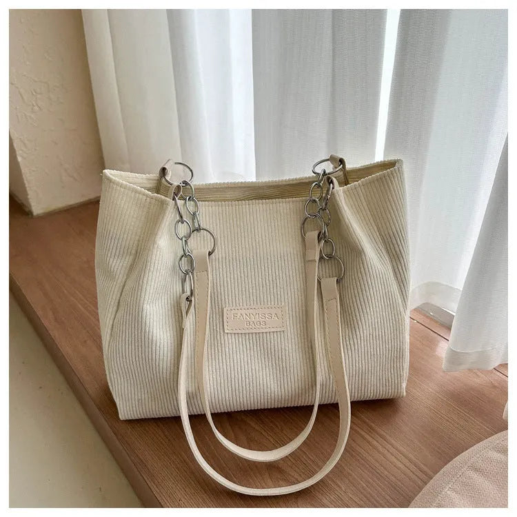Corduroy one-shoulder tote handbag in horizontal square shape with three-dimensional pocket