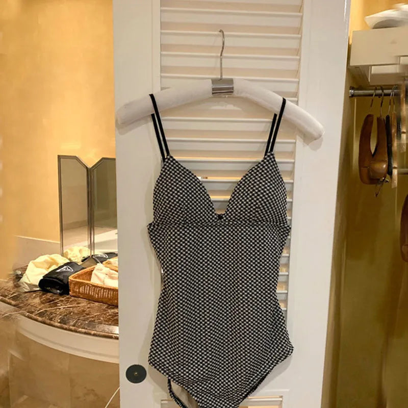 Blue or black one-piece hot spring swimsuit with coverage design in polyester fabric