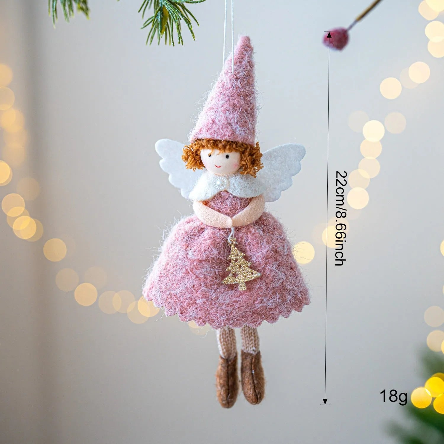 Close-up of a white cloth angel skirt felt pendant Christmas tree ornament.
