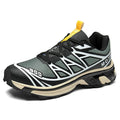 Low top hiking shoes in khaki with round toe, artificial leather upper, and flat rubber sole.