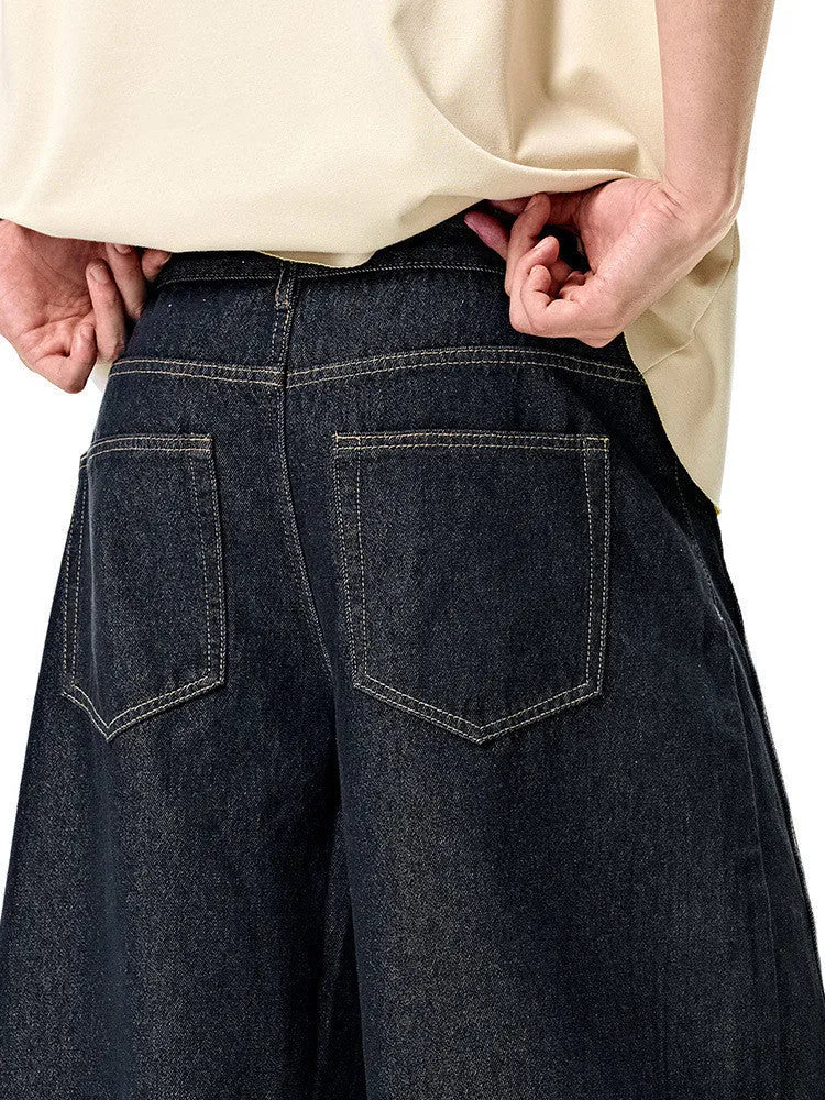 Men's wide leg denim trousers in original cow colour on a mid-waist model