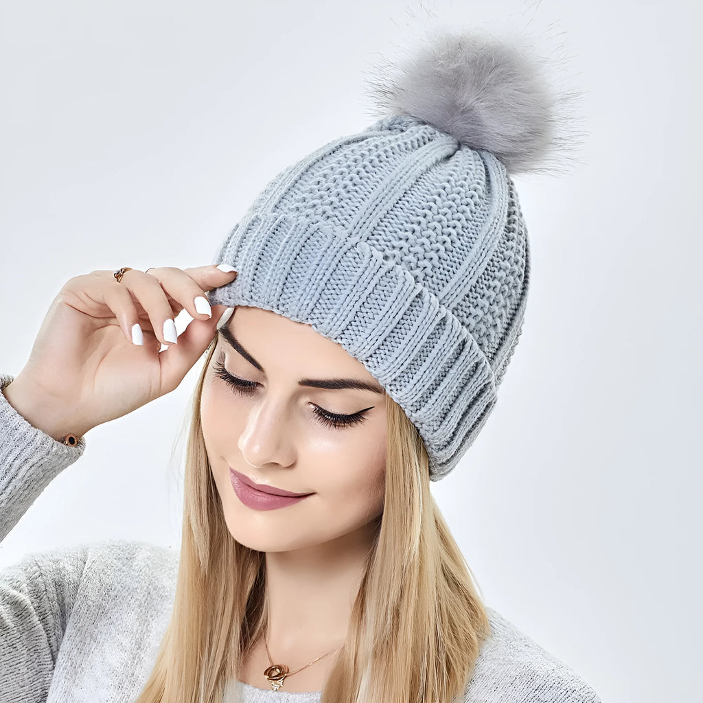 Women's satin-lined wool beanie with faux fur pom pom in various colours