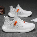 Men's white woven mesh platform sneakers with round toe and flat rubber sole on a plain background.