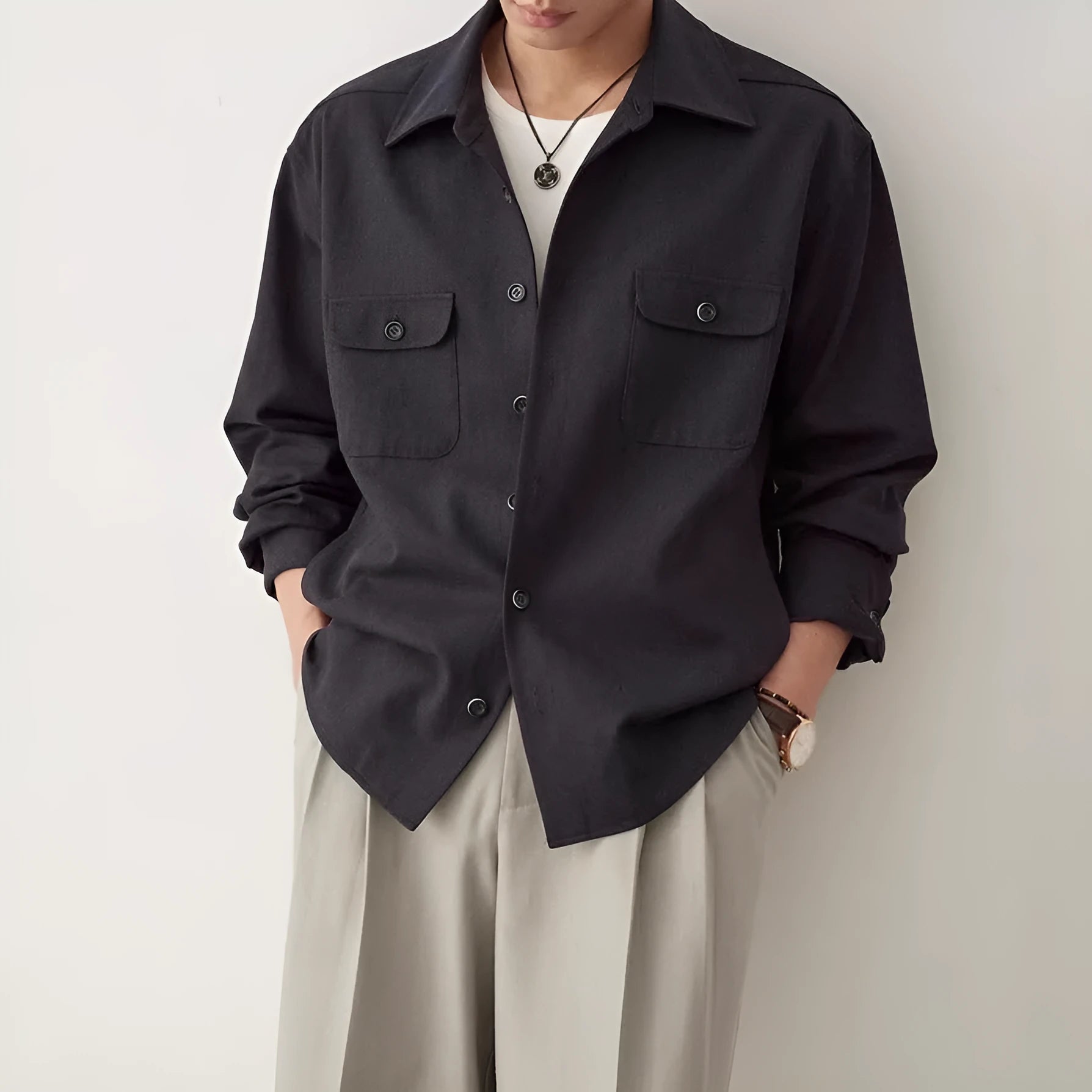 Men's light sand rice coloured lapel shirt with long sleeves on a hanger