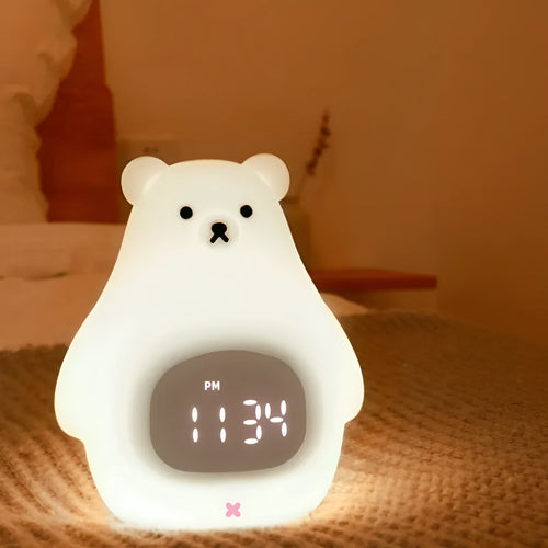 A white silicone night light shaped like a bear with a sleep timer and remote control.