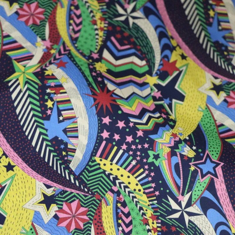 Blue cotton fabric with digitally printed plant and flower design showing 145cm width