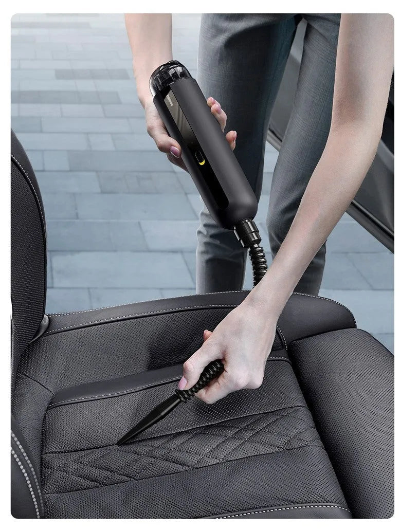 Baseus wireless handheld car vacuum cleaner in black, showing mini size and nozzle attachments.