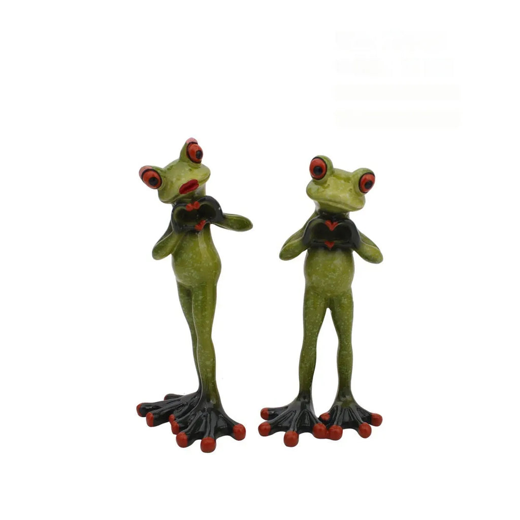 Synthetic resin pastoral style frog figurine home decoration ornament on a surface.