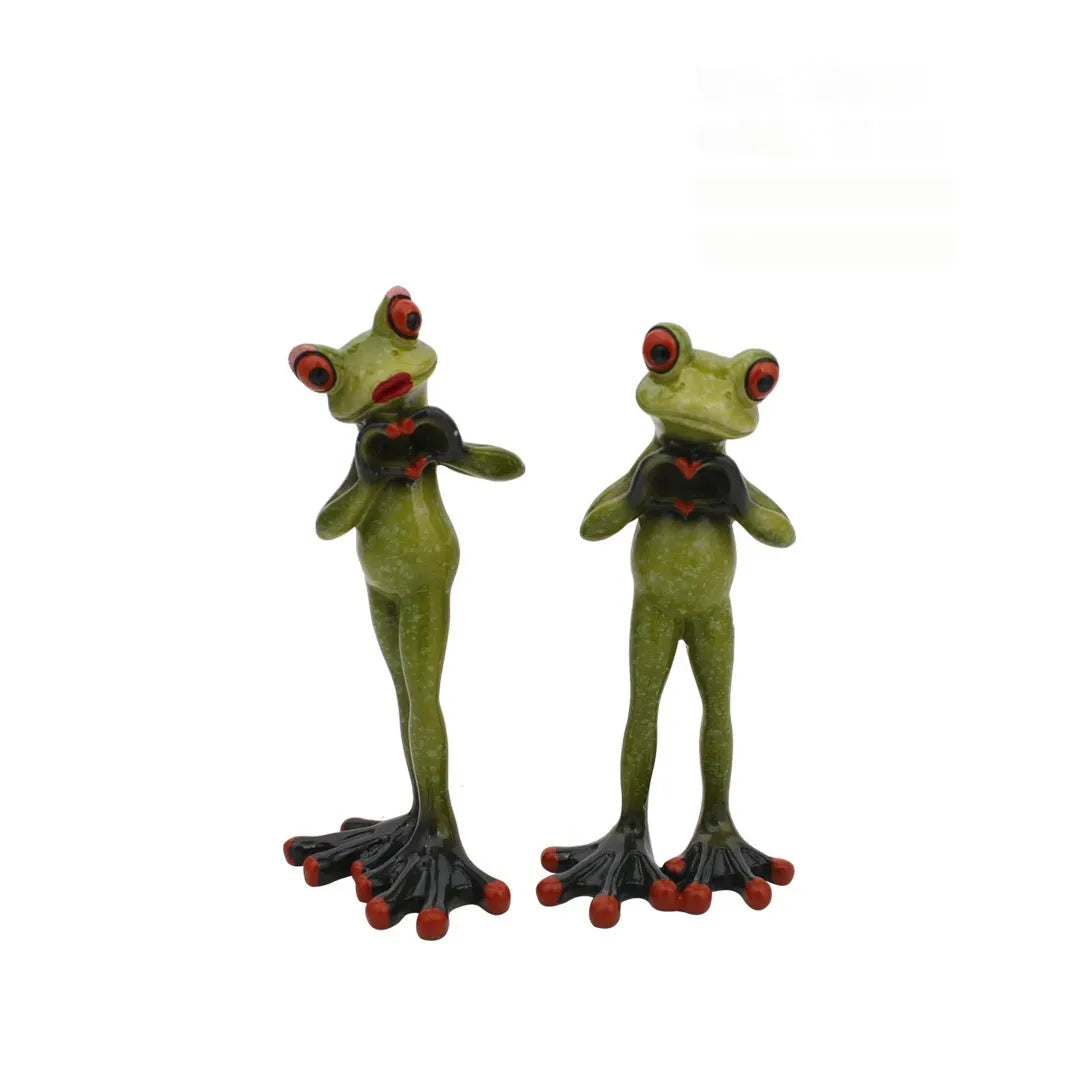 Synthetic resin pastoral style frog figurine home decoration ornament on a surface.