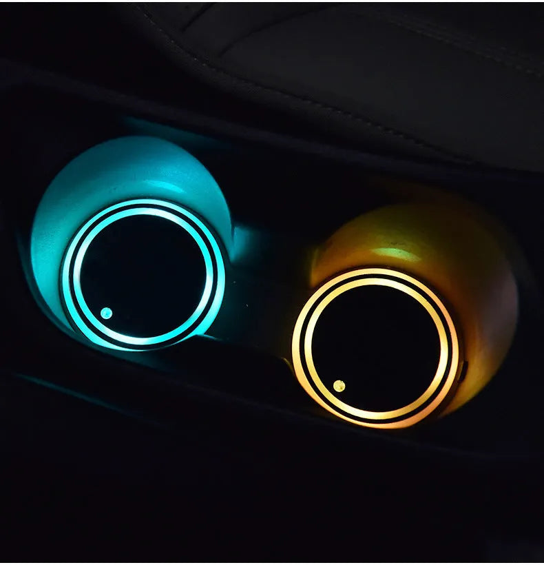 Colourful LED light-up coaster for car cup holder with solar panel and USB port.