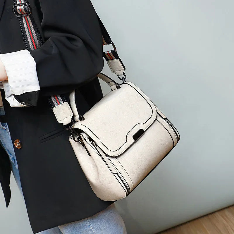 Genuine leather women's messenger bag in horizontal square shape with internal organisation pockets
