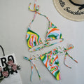Women's split bikini with double fabric lace-up front in printed polyester and solid colour nylon