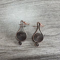 Bronze spiral psychedelic drop earrings with geometric shape and alloy construction