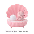 Resin cartoon small night lamp with pink pig girl design on a table