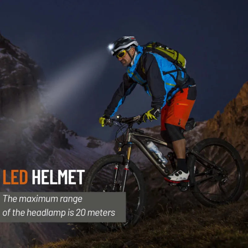 Black and grey adult cycling helmet with integrated warning lights on the rear.